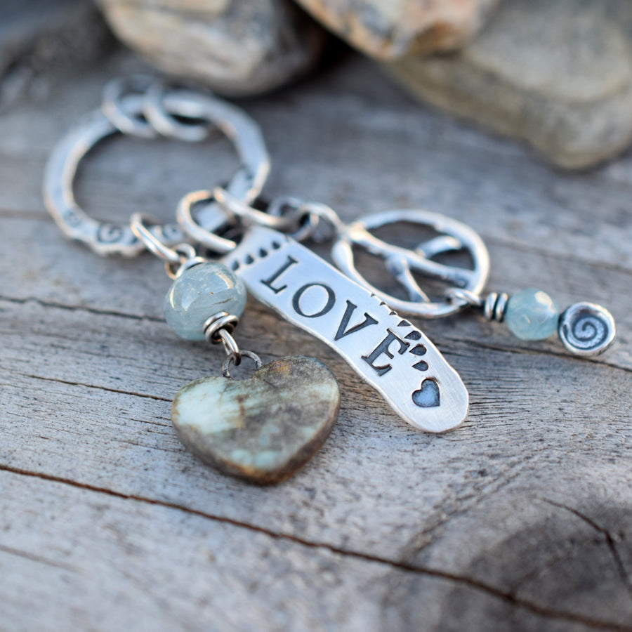 Peace and Love Inspired Jewelry. Handcrafted Silver Jewelry. Porcelain Heart charm with Blue Aquamarine Gemstones and Peace Sign in Pure Silver.