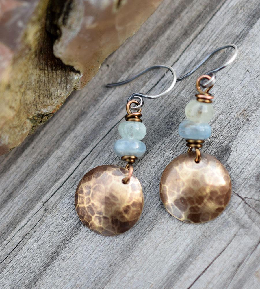 Aquamarine Gemstone earrings with golden brass charms. 